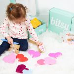 little girl playing on the floor